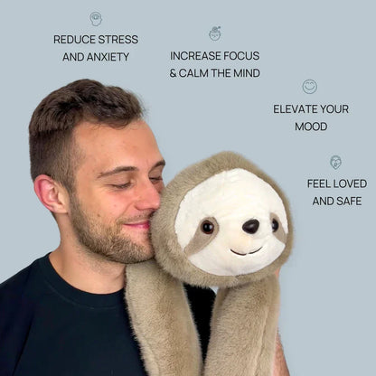 Smiling man nuzzling a sloth plush whose long soft arms hang down over his shoulder. 7
