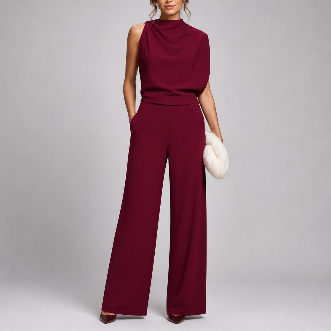 Model wearing the jumpsuit in burgundy with a draped cowl-style neckline and matching heels 7