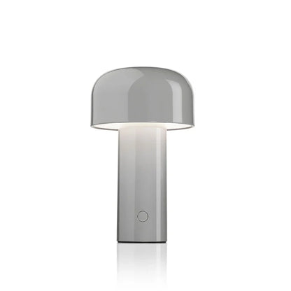 Glossy grey mushroom lamp with a domed shade glowing underneath, on a white background 6
