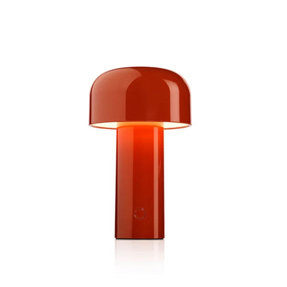 Glossy red-orange mushroom-shaped lamp lit on a white background, showing the round button on the stem 2