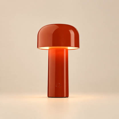 Glossy red lamp lit against a beige backdrop, showing the round switch on its stem 29