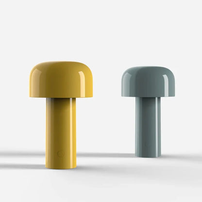 Yellow lamp and a slightly smaller grey-green lamp side by side on a pale studio background 15