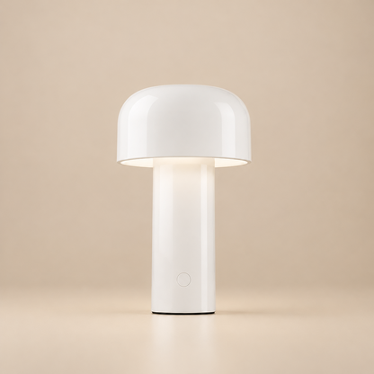 White glossy mushroom lamp lit against a beige backdrop, with a round button on the stem 28