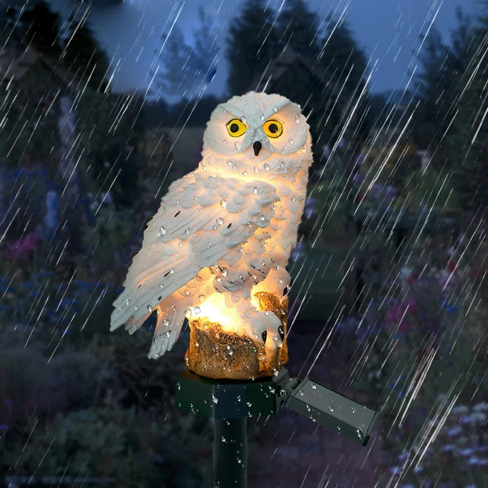 Glowing owl light covered in raindrops during heavy rain, showing it is weatherproof outdoors at night. 10