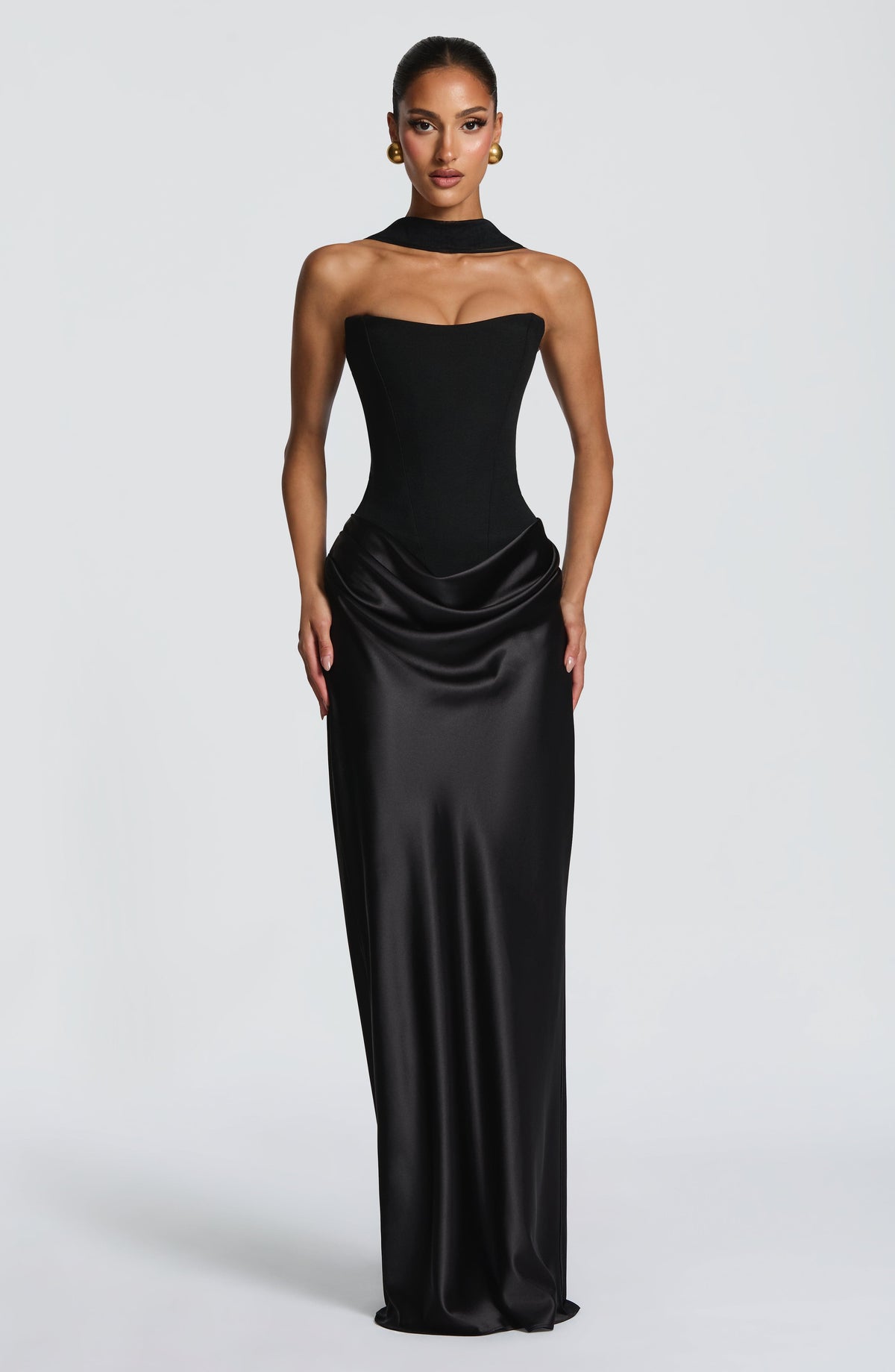 Front view of black strapless corset maxi dress with satin cowl skirt and matching neck scarf 20