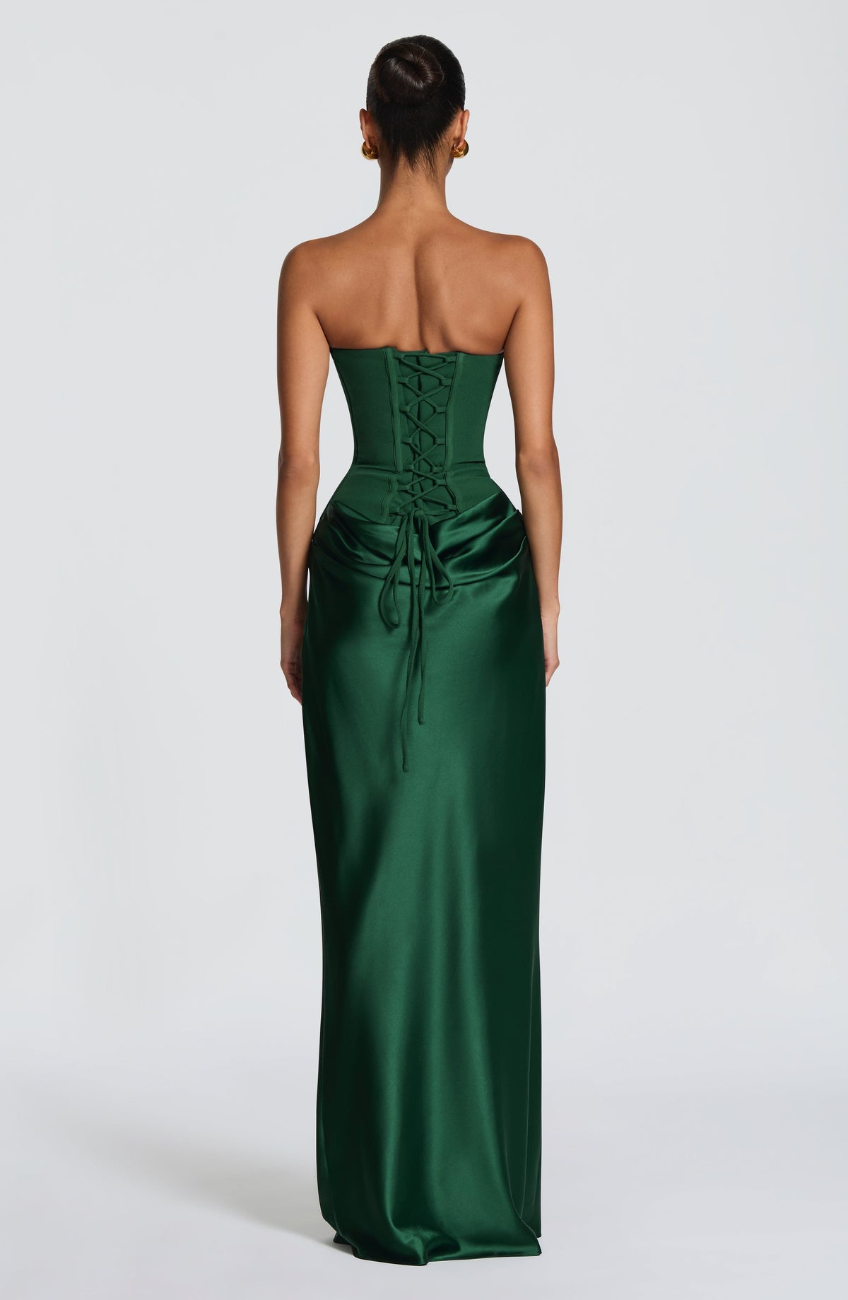 Back view of the green corset dress showing the lace-up corset back and trailing ties 30
