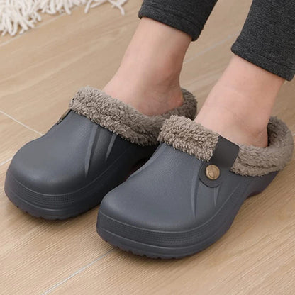 Feet in grey fur-lined clogs on a light wooden floor, worn with dark leggings 11