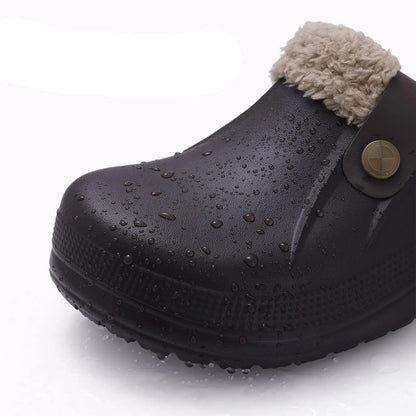 Close-up of a dark brown clog toe covered in water droplets, showing its waterproof surface 7