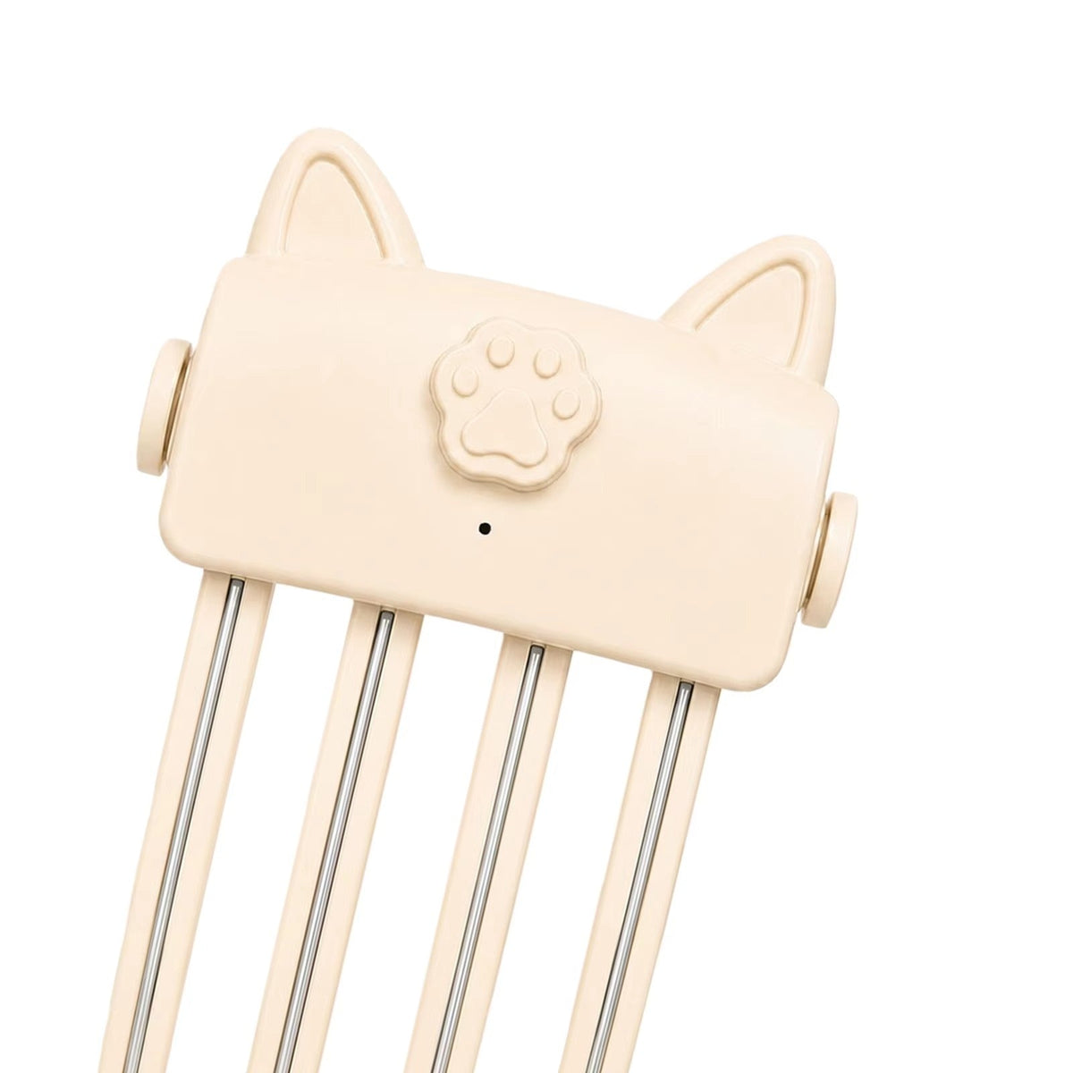 Close-up of the cream cat-ear styler head, showing the raised paw button and metal strips on the prongs 8