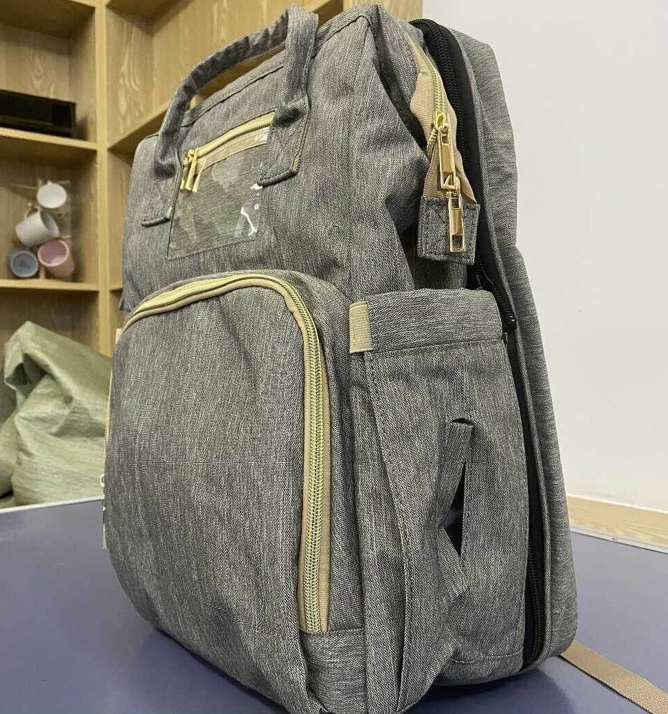Convertible baby-changing backpack with fold-out baby bed – waterproof, multi-pocket design