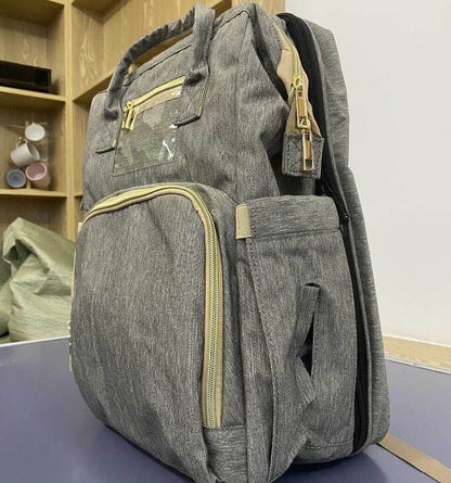 Convertible baby-changing backpack with fold-out baby bed – waterproof, multi-pocket design