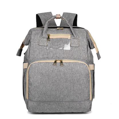 Convertible baby-changing backpack with fold-out baby bed – waterproof, multi-pocket design