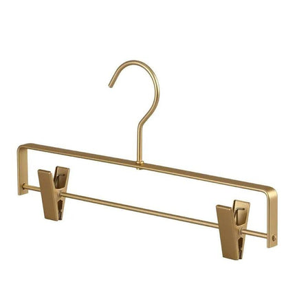 Gold matt metal trousers hanger with two clips, front view on a white background 6