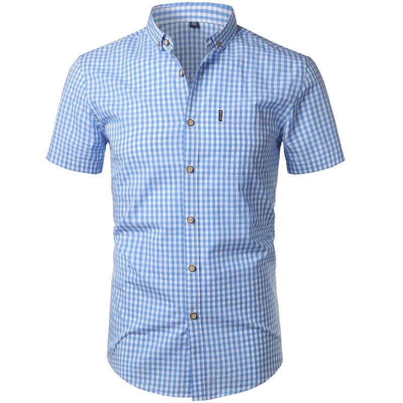 Front view of a light blue and white gingham shirt with short sleeves, buttoned placket, collar and chest pocket. 1