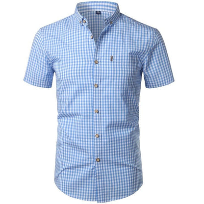Front view of a light blue and white gingham shirt with short sleeves, buttoned placket, collar and chest pocket. 1