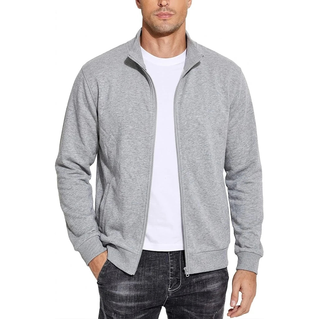 Man wearing the light grey marl zip-up jacket open over a white t-shirt and dark jeans, front view. 7