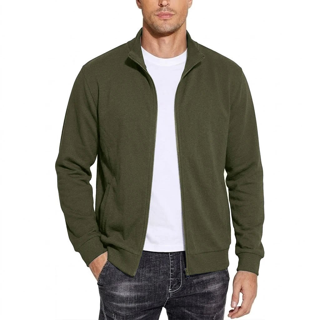 Man wearing the olive green zip-up jacket open over a white t-shirt, front view with ribbed cuffs and hem. 6