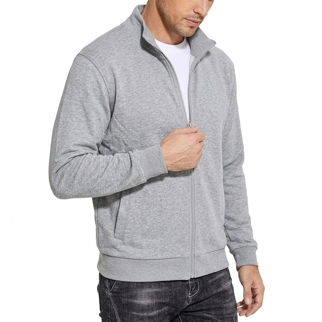 Angled view of the light grey marl jacket zipped up, showing the stand collar, side pocket and ribbed hem. 2