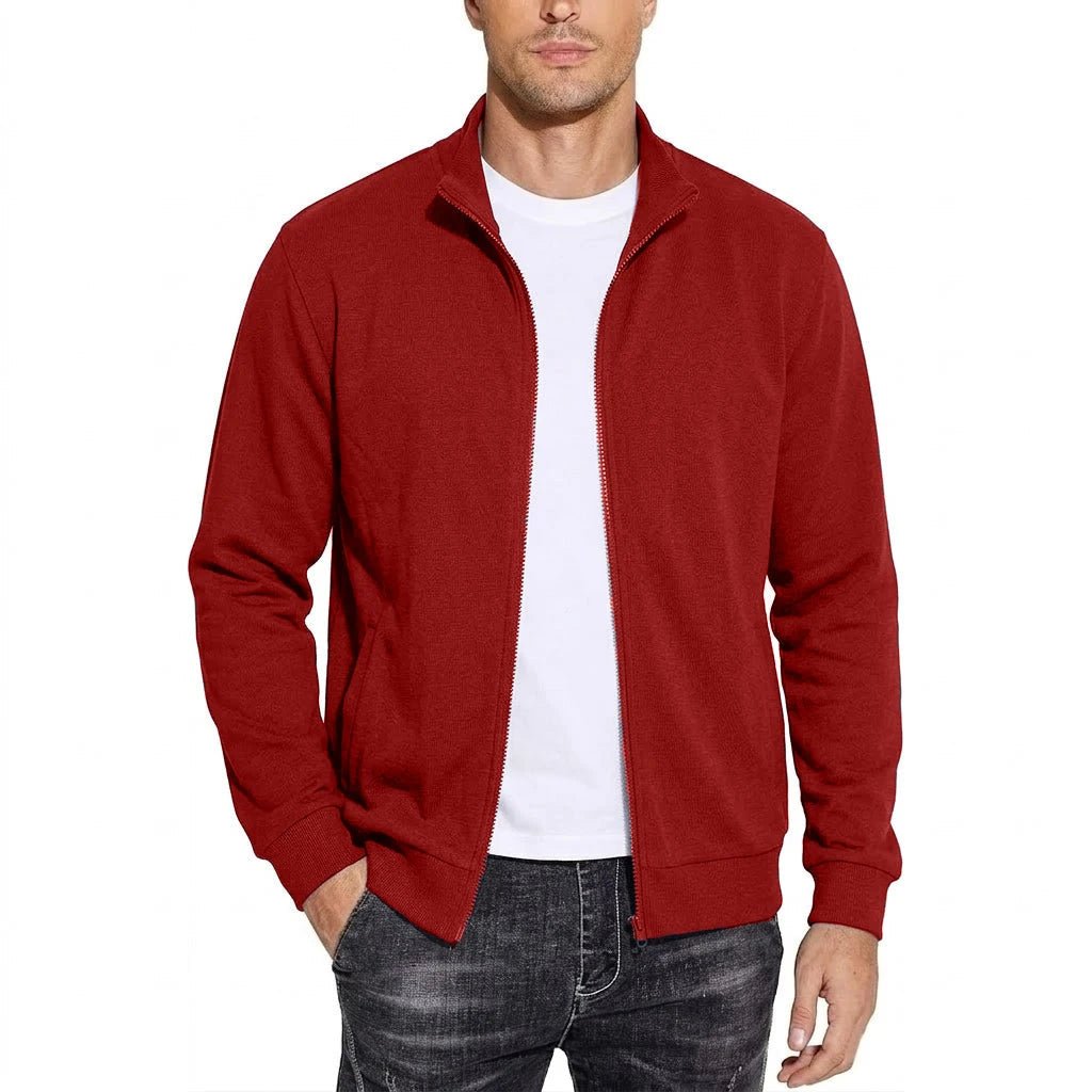 Man wearing the red zip-up jacket open over a white t-shirt with ribbed cuffs, front view. 4