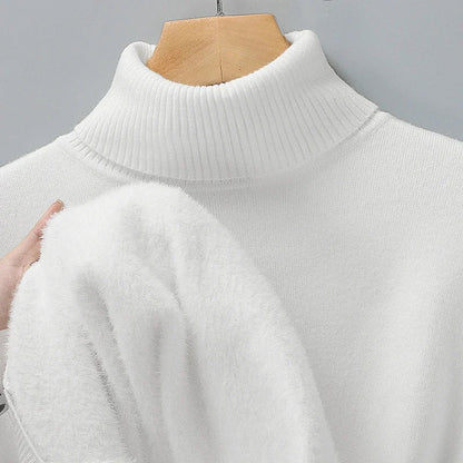 White turtleneck jumper on a hanger, with a hand showing the soft fluffy lining inside 5