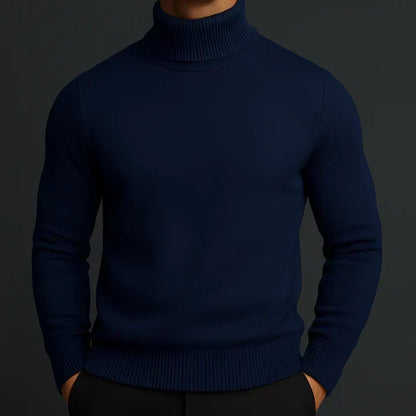 Model wearing a navy blue turtleneck jumper with ribbed trims, hands in black trouser pockets 3