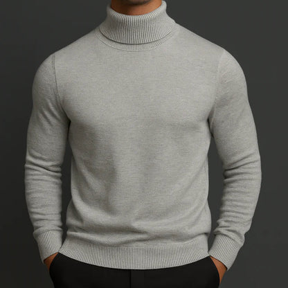 Model wearing a light grey turtleneck jumper with ribbed cuffs and hem, front view 2