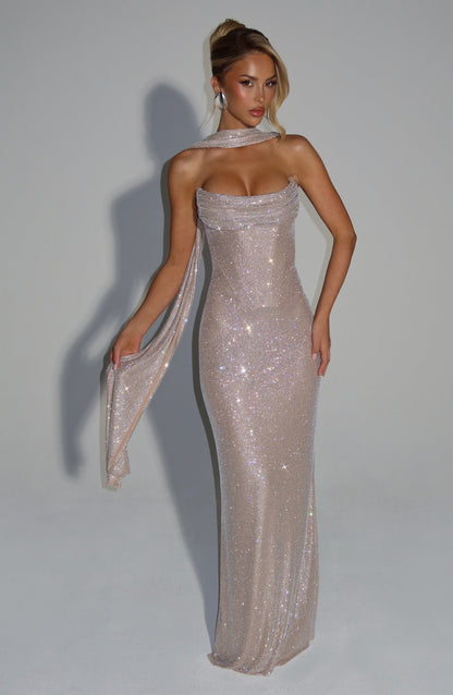 Champagne rhinestone maxi dress styled with a matching sparkly scarf draped around the neck and over one arm. 17
