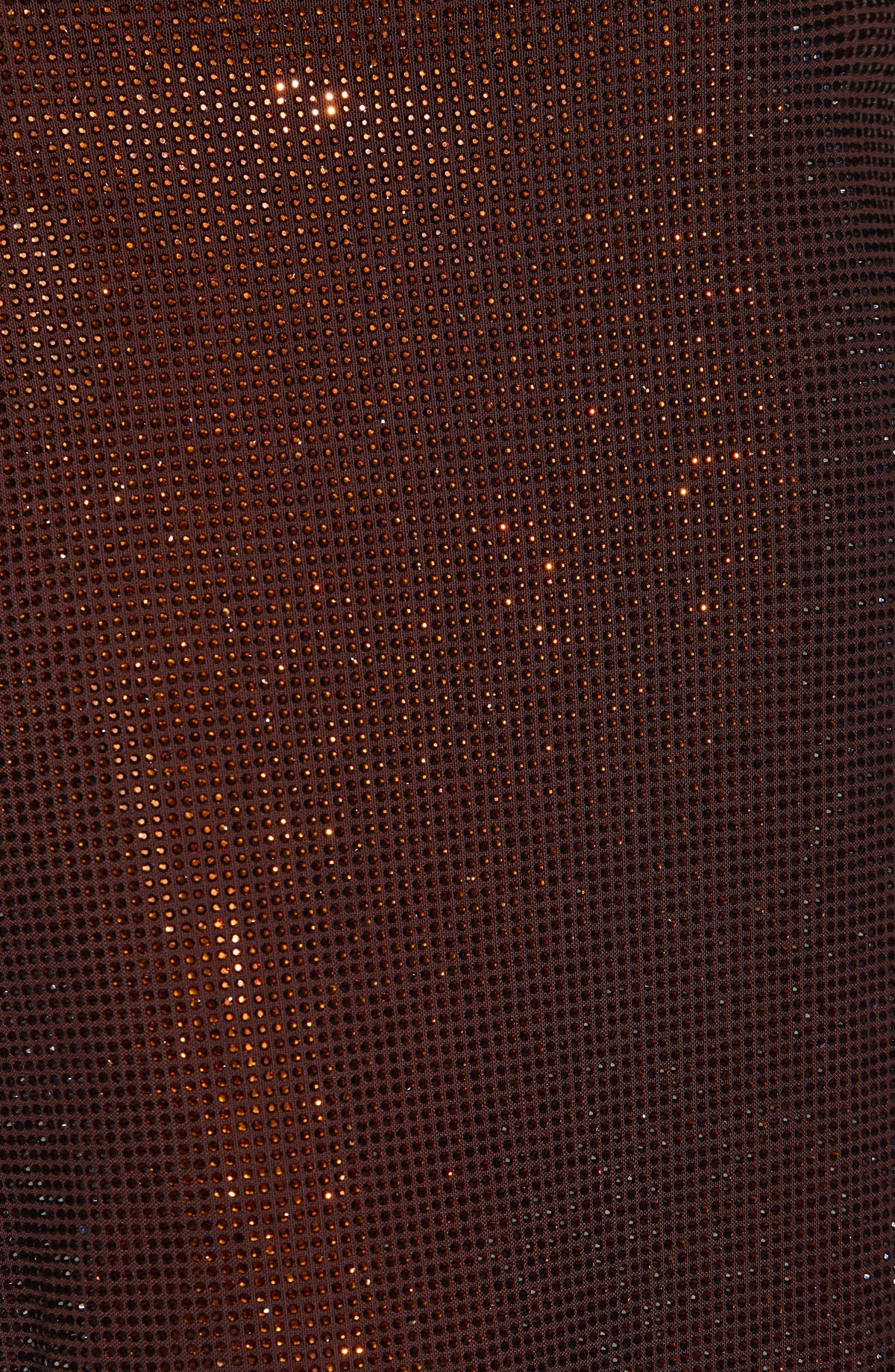 Extreme close-up of the brown fabric's grid of small rhinestones sparkling over the mesh. 9
