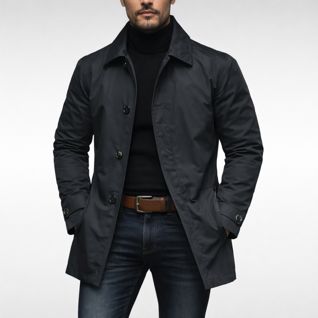 Black version worn by a model, front view with the coat open over a black roll-neck and blue jeans. 4