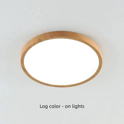 Light natural wood-finish round light on a ceiling, switched on and shining brightly through its diffuser. 20