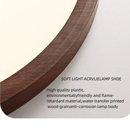 Close-up of the curved dark walnut-effect wood grain edge of the light, with a soft white diffuser behind and descriptive text overlay. 21