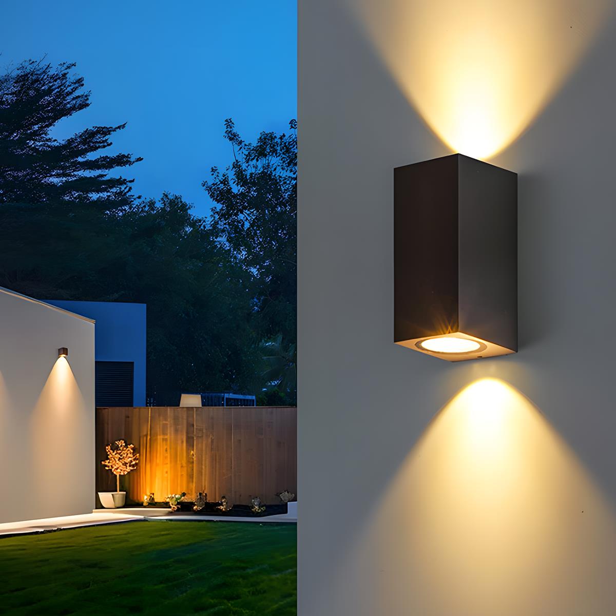 Close view of a black double-beam wall light on a wall, with a lit garden behind 9