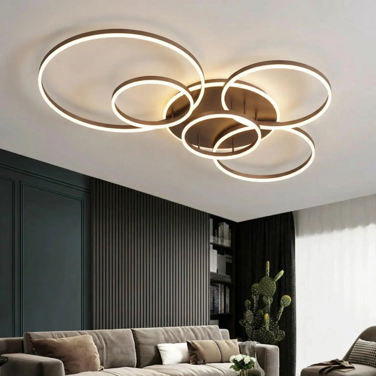 Brown-framed version of the glowing ring light lit above a sofa in a dark panelled lounge 2