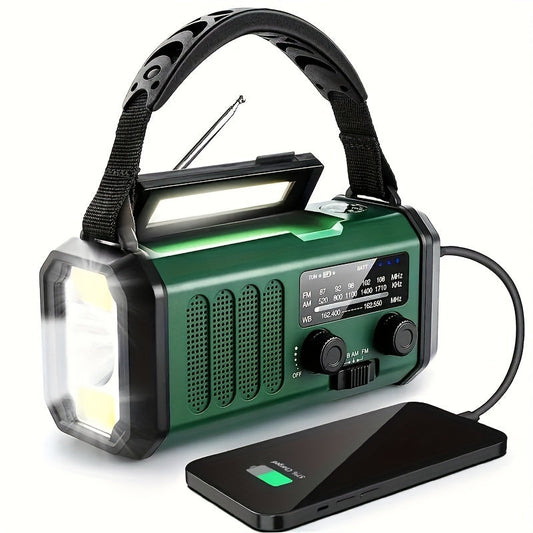 Green radio with carry strap and glowing front light, charging a smartphone through a cable 1