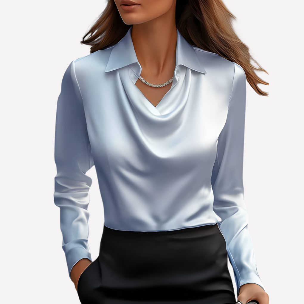Model wearing the pale blue satin blouse with a draped cowl neckline and collar, with a black skirt 6