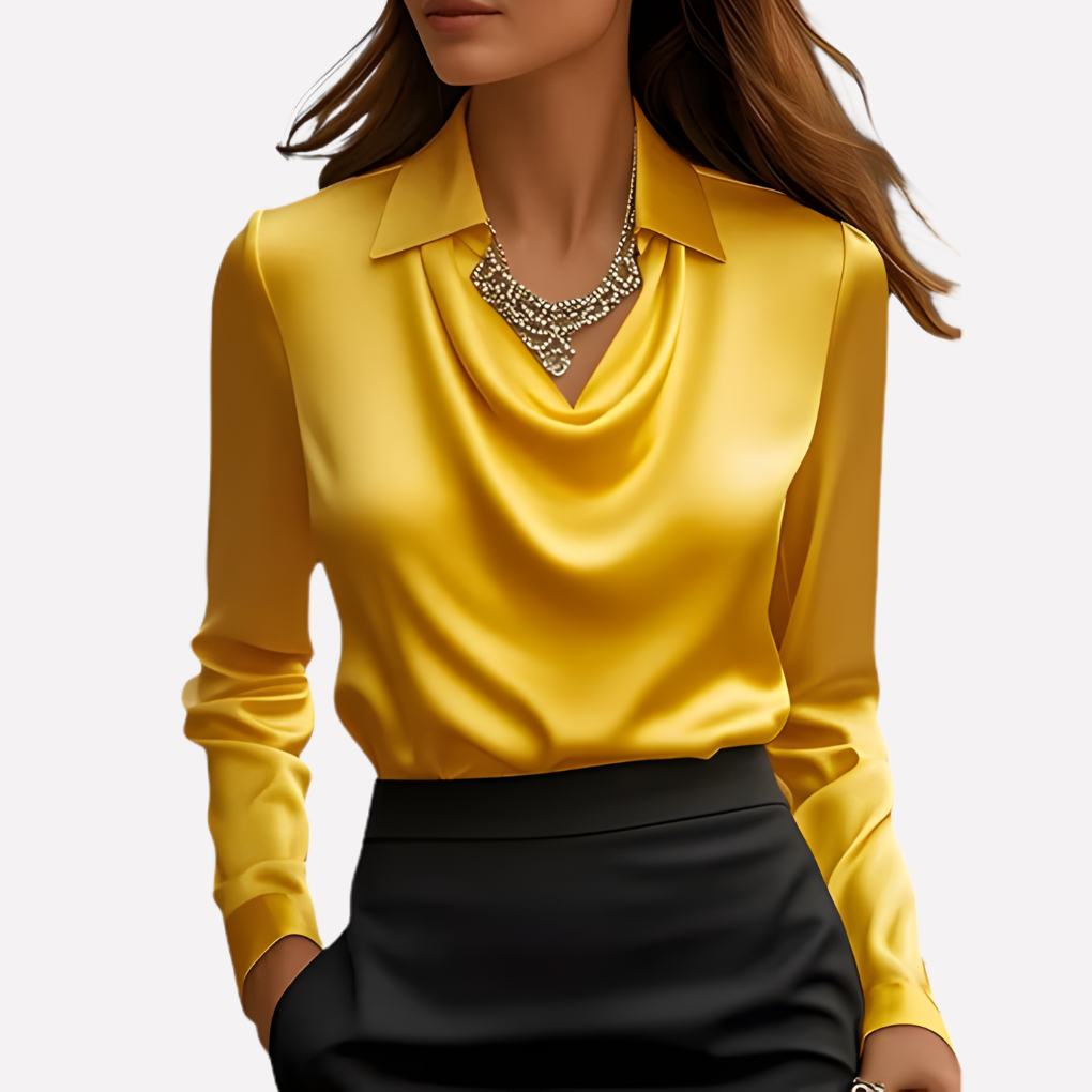 Model wearing the bright yellow satin blouse with a draped cowl neckline and a statement jewelled necklace 10