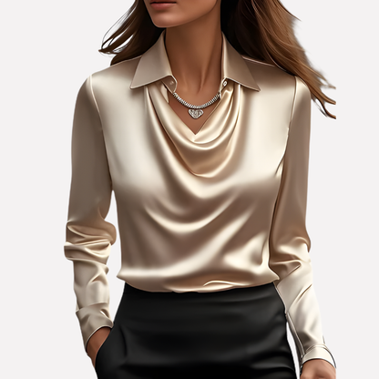 Model wearing the champagne satin blouse with a glossy cowl neckline and button cuffs, with a pendant necklace 5