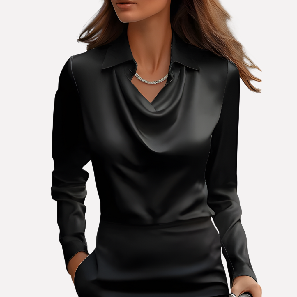 Model wearing the black satin blouse with a draped cowl neckline and pointed collar, with a silver necklace 2
