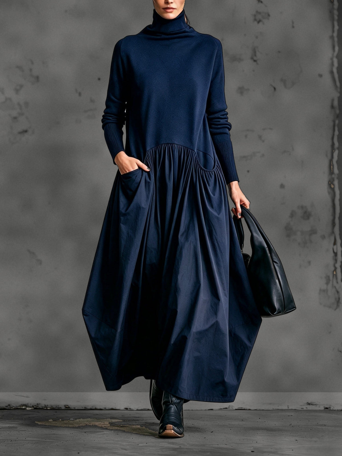 Model wearing the dress in navy blue, front view with hand in the side pocket 6