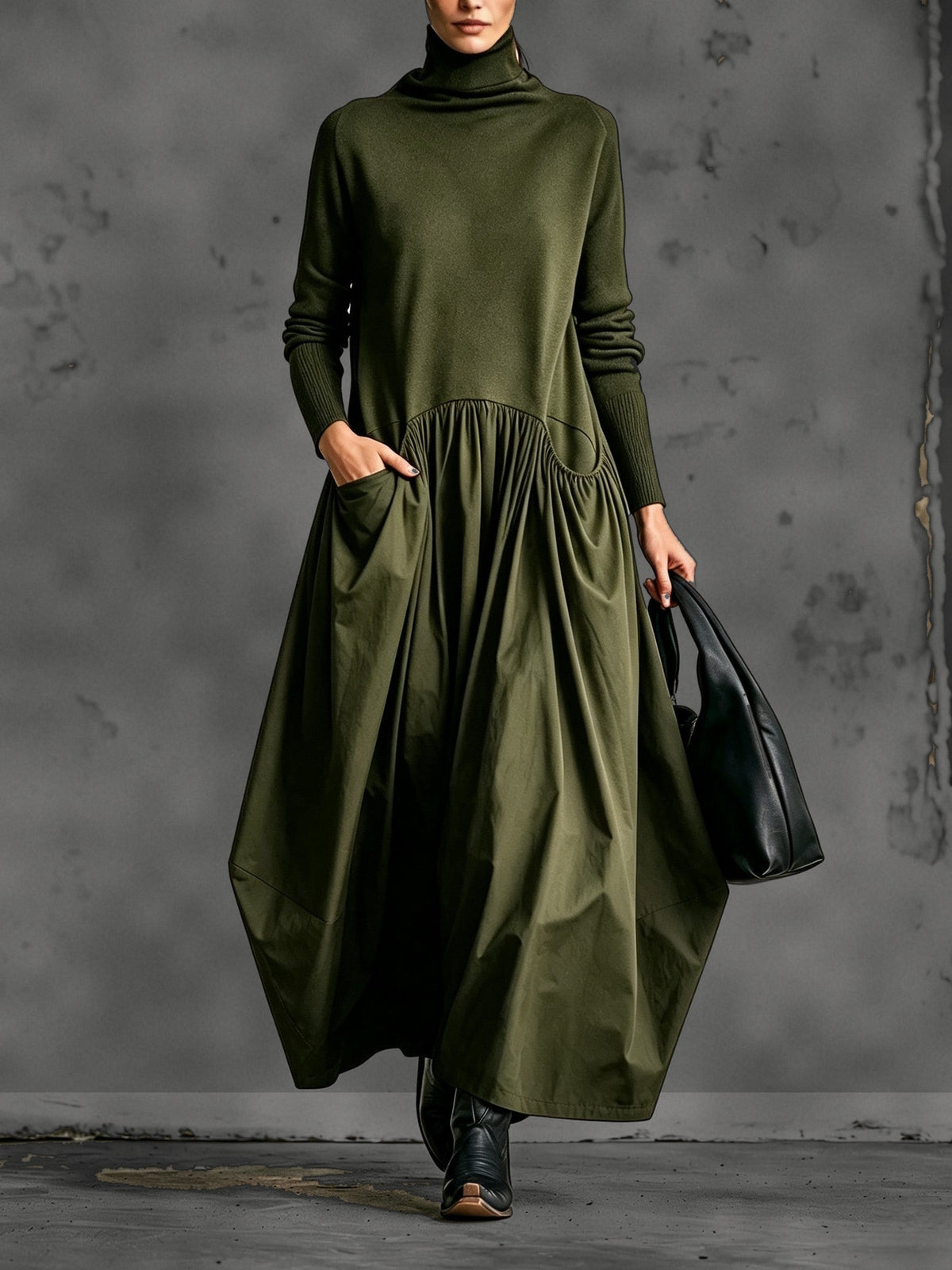 Model wearing the dress in olive green, front view with hand in the side pocket 4