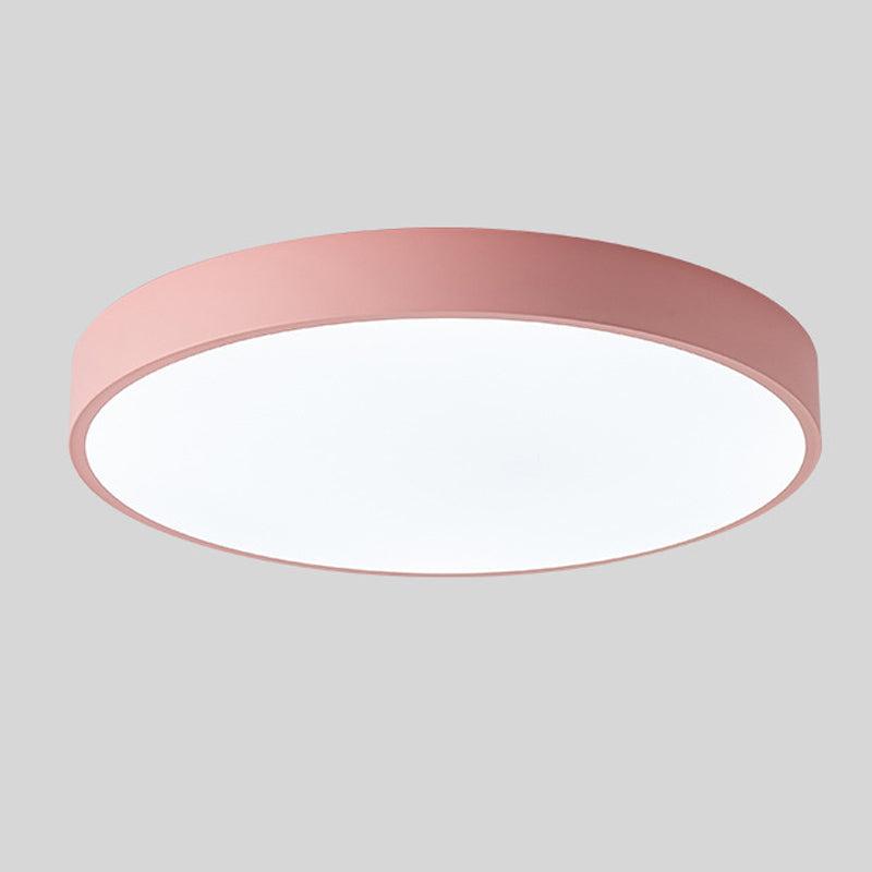 Pink round slim ceiling light with no wood accent, shown from below at an angle on a plain grey background. 10
