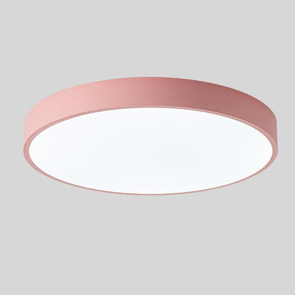 Pink round slim ceiling light with no wood accent, shown from below at an angle on a plain grey background. 10