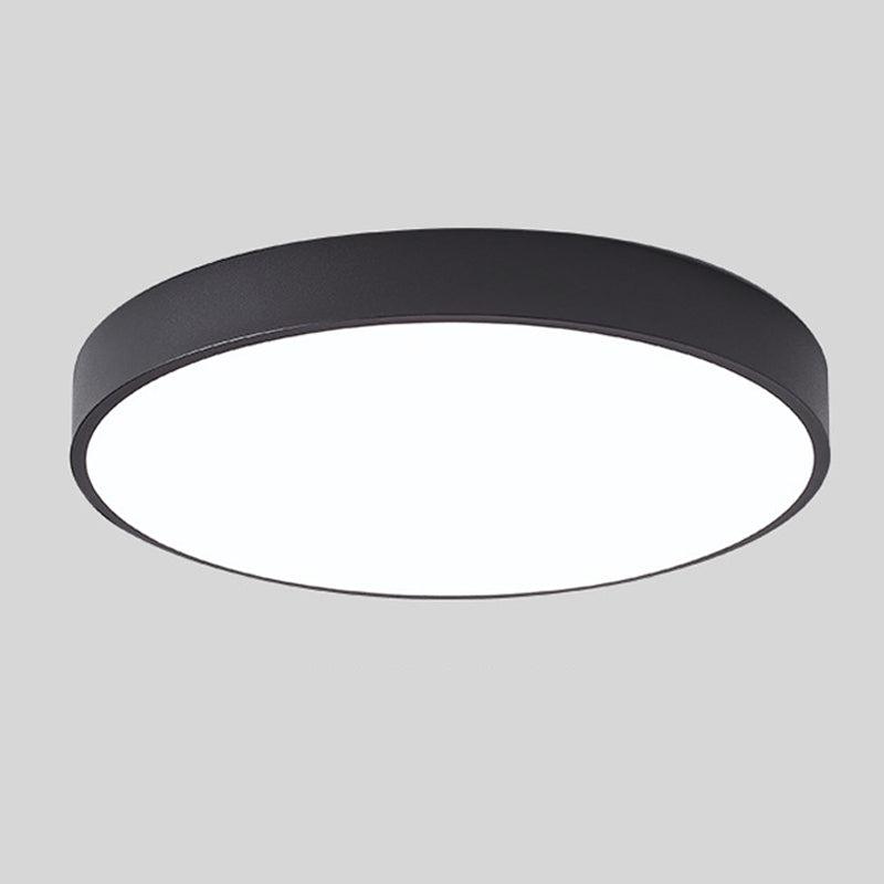 Black round slim ceiling light with no wood accent, shown from below at an angle on a plain grey background. 11