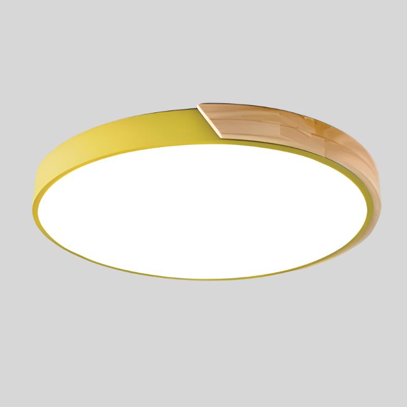 Yellow round ceiling light with a wooden segment on the rim, shown from below against a plain grey background. 15