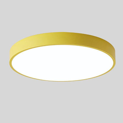 Yellow round slim ceiling light with no wood accent, shown from below at an angle on a plain grey background. 9