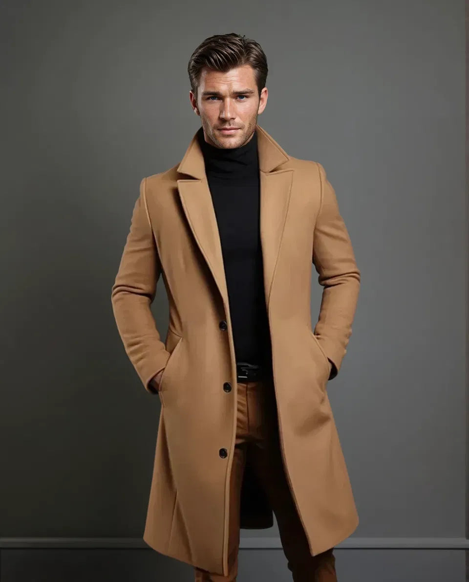 Full-length view of the camel coat on a model with his face visible, showing lapels, buttons and a knee-length cut. 5