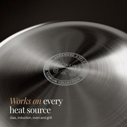 Close-up of the pan's underside, showing the brushed concentric finish and a small circular emblem with icons for heat sources. 6