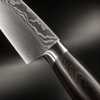 Close-up of one blade's layered steel pattern, its metal bolster and the grained dark wooden handle. 3