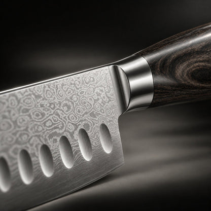 Close-up of the blade heel, steel bolster and dark wood grain, showing the swirling layered-steel pattern 3