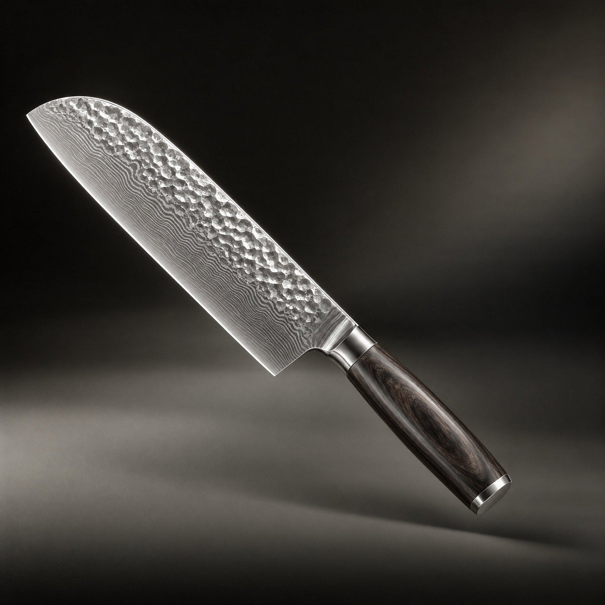 Santoku knife angled diagonally against a dark backdrop, showing its hammered, rippled steel blade and dark wooden handle 1